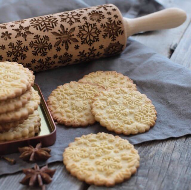 embossed co rolling pin snowflake design imprinted on cookies